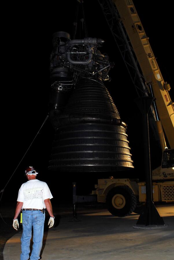 Lifting F-1 rocket engine onto throat support during F-4023 Installation at Building 4205 (October 21, 2009) at Marshall Space Flight Center Engine Displays