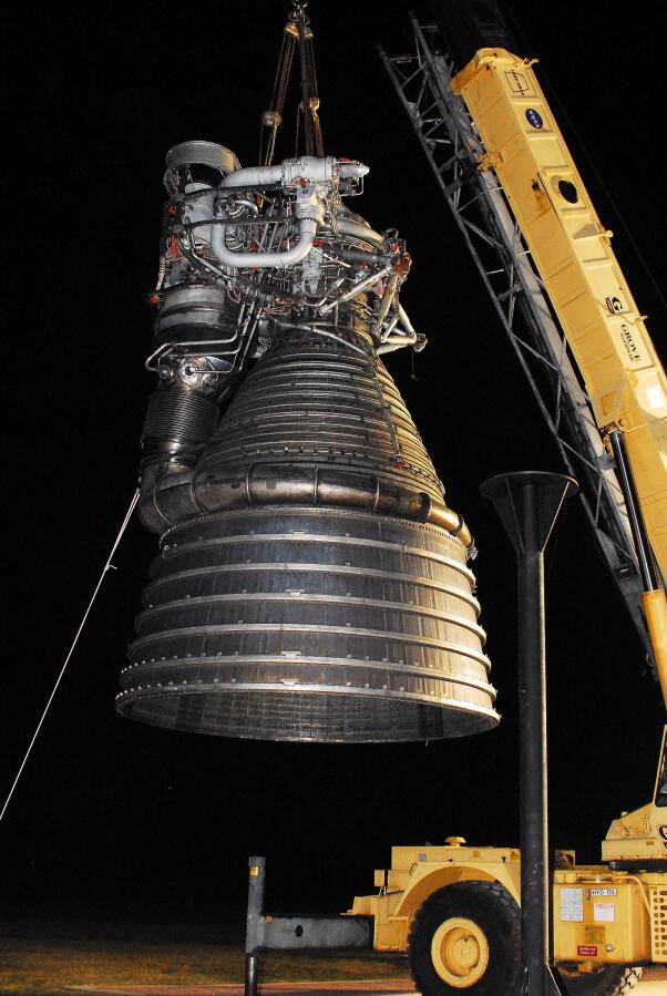 Lifting F-1 rocket engine onto throat support during F-4023 Installation at Building 4205 (October 21, 2009) at Marshall Space Flight Center Engine Displays