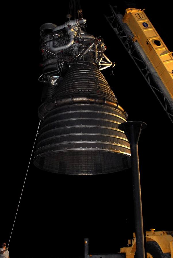 Lifting F-1 rocket engine onto throat support during F-4023 Installation at Building 4205 (October 21, 2009) at Marshall Space Flight Center Engine Displays