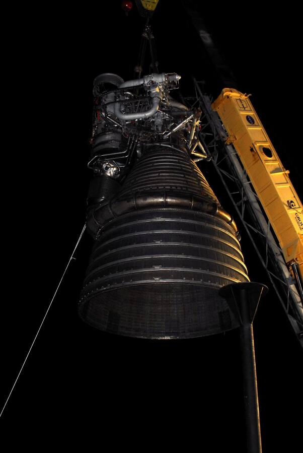 Lifting F-1 rocket engine onto throat support during F-4023 Installation at Building 4205 (October 21, 2009) at Marshall Space Flight Center Engine Displays