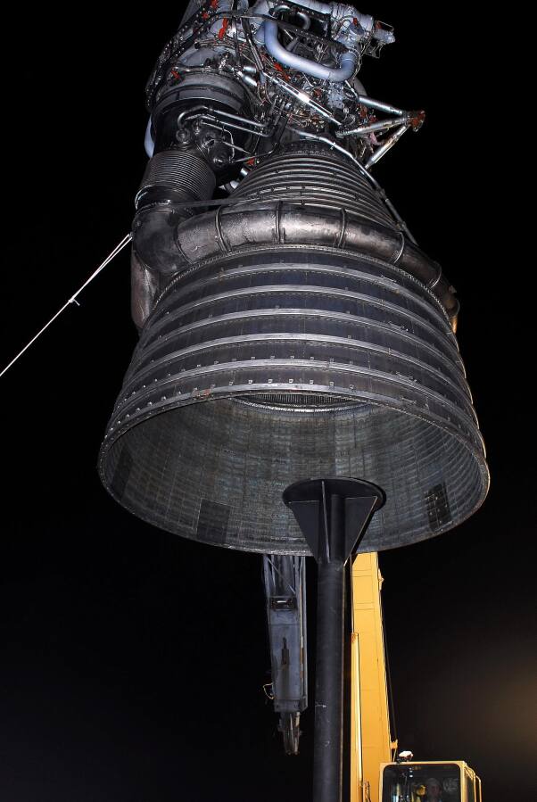 Lifting F-1 rocket engine onto throat support during F-4023 Installation at Building 4205 (October 21, 2009) at Marshall Space Flight Center Engine Displays