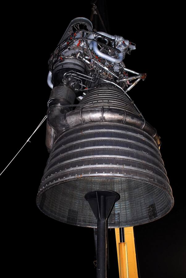 Lowering F-1 rocket engine onto throat support during F-4023 Installation at Building 4205 (October 21, 2009) at Marshall Space Flight Center Engine Displays
