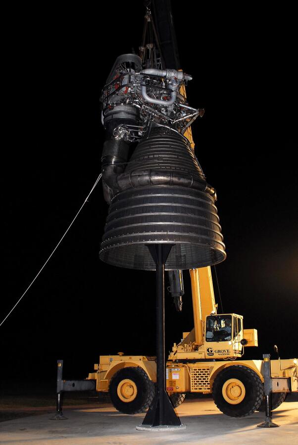Lowering F-1 rocket engine onto throat support during F-4023 Installation at Building 4205 (October 21, 2009) at Marshall Space Flight Center Engine Displays