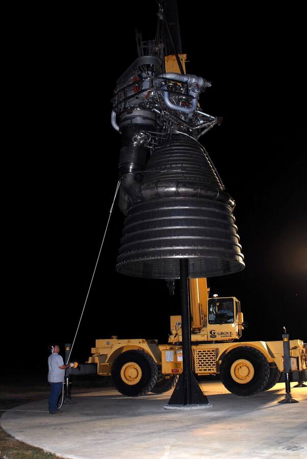 Lowering F-1 rocket engine onto throat support during F-4023 Installation at Building 4205 (October 21, 2009) at Marshall Space Flight Center Engine Displays