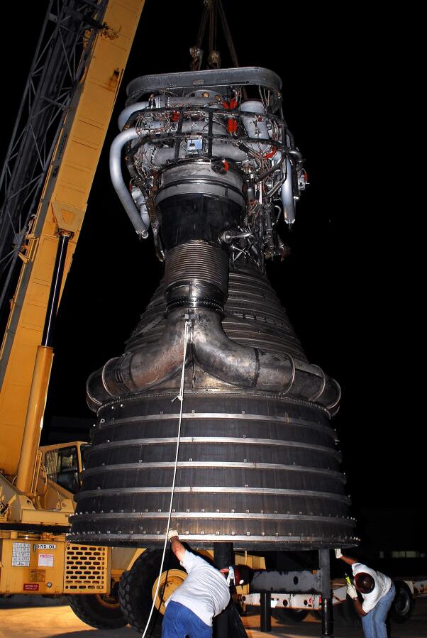 Lowering F-1 rocket engine onto throat support during F-4023 Installation at Building 4205 (October 21, 2009) at Marshall Space Flight Center Engine Displays