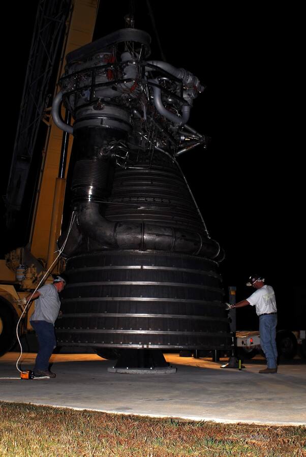 Lowering F-1 rocket engine onto throat support during F-4023 Installation at Building 4205 (October 21, 2009) at Marshall Space Flight Center Engine Displays