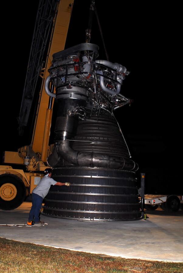 Lowering F-1 rocket engine onto throat support during F-4023 Installation at Building 4205 (October 21, 2009) at Marshall Space Flight Center Engine Displays