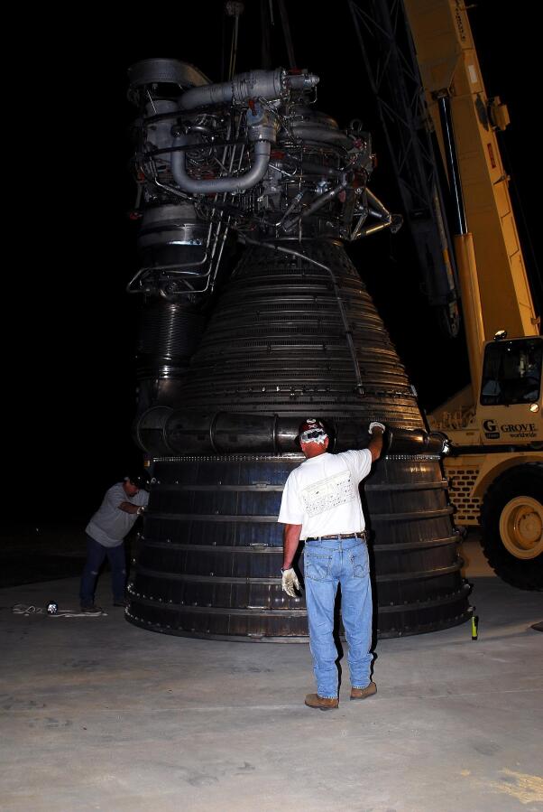 Lowering F-1 rocket engine onto throat support during F-4023 Installation at Building 4205 (October 21, 2009) at Marshall Space Flight Center Engine Displays
