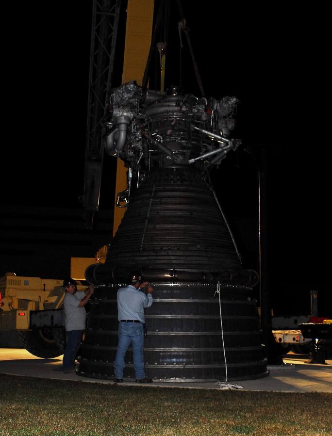 Bolting the nozzle extension to the F-1 thrust chamber during F-4023 Installation at Building 4205 (October 21, 2009) at Marshall Space Flight Center Engine Displays