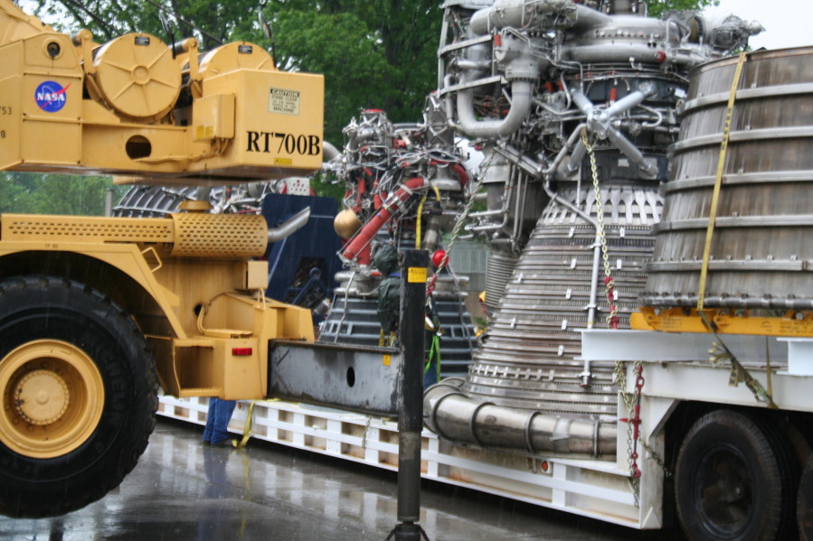 F-1 rocket engine nozzle extension, F-1 rocket engine, J-2 rocket engine, and Space Shuttle Main Engine (SSME) in front of Building 4200 during Installation of Building 4200 Engines (May 13, 2008) at Marshall Space Flight Center Engine Displays