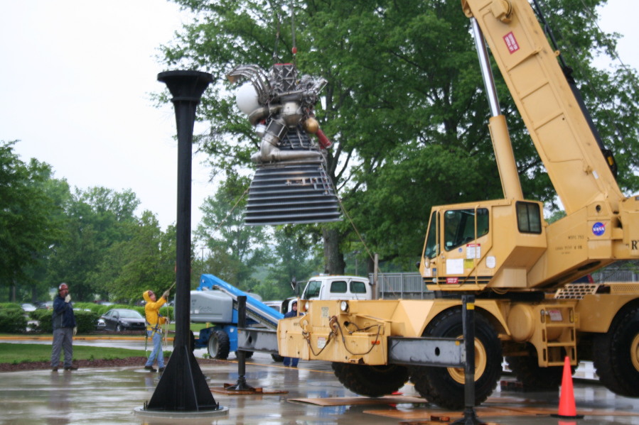 Placing J-2 rocket engine on throat support during Installation of Building 4200 Engines (May 13, 2008) at Marshall Space Flight Center Engine Displays