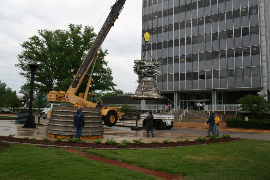 Placing F-1 rocket engine thrust chamber on nozzle extension during Installation of Building 4200 Engines (May 13, 2008) at Marshall Space Flight Center Engine Displays