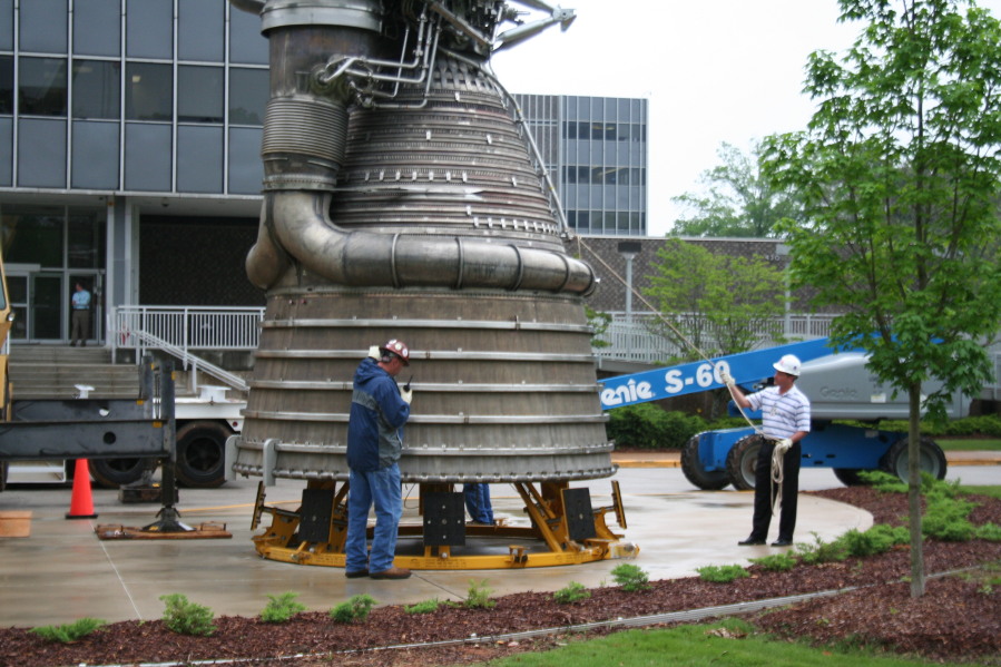 Placing F-1 rocket engine on throat support during Installation of Building 4200 Engines (May 13, 2008) at Marshall Space Flight Center Engine Displays