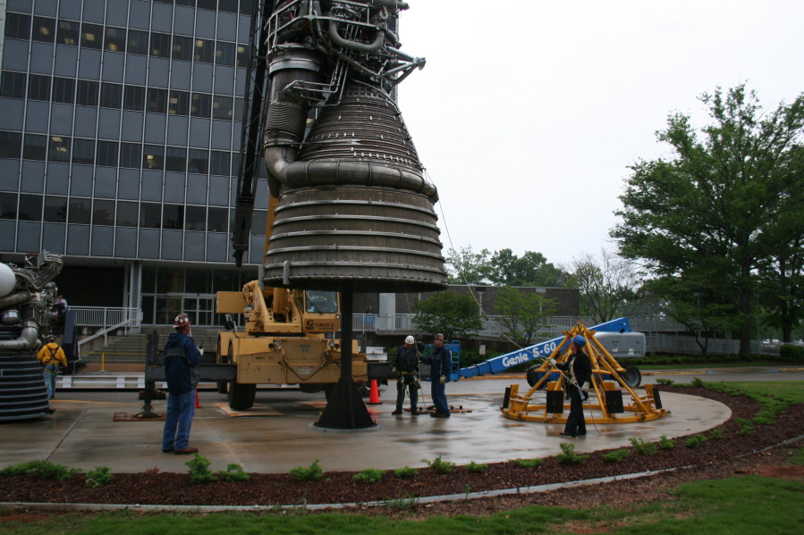 Placing F-1 rocket engine on throat support during Installation of Building 4200 Engines (May 13, 2008) at Marshall Space Flight Center Engine Displays