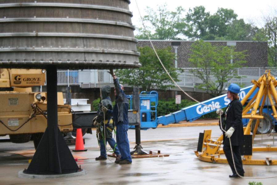 Placing F-1 rocket engine on throat support during Installation of Building 4200 Engines (May 13, 2008) at Marshall Space Flight Center Engine Displays