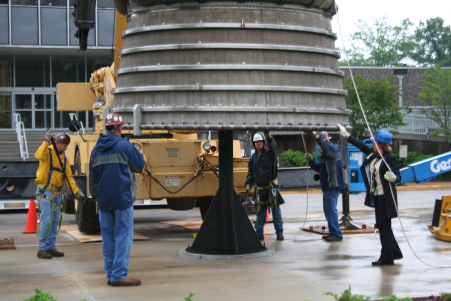 Placing F-1 rocket engine on throat support during Installation of Building 4200 Engines (May 13, 2008) at Marshall Space Flight Center Engine Displays