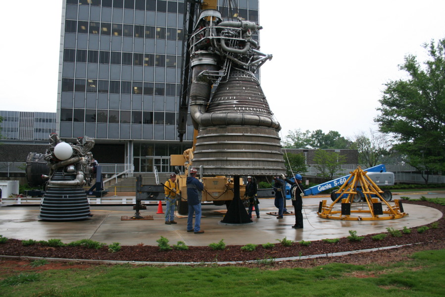 Placing F-1 rocket engine on throat support during Installation of Building 4200 Engines (May 13, 2008) at Marshall Space Flight Center Engine Displays