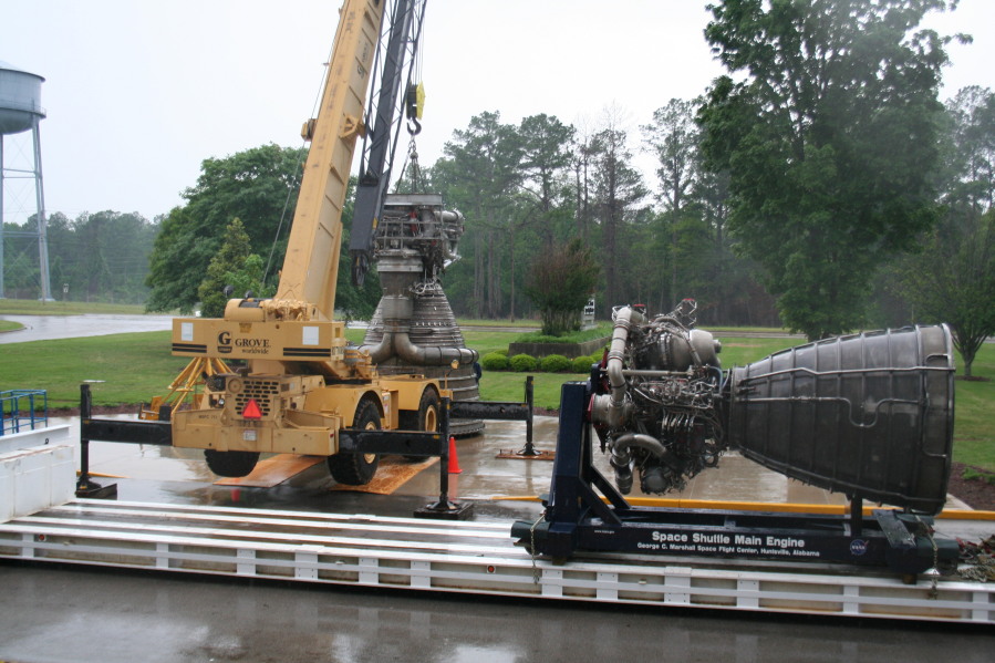 Placing F-1 rocket engine on throat support during Installation of Building 4200 Engines (May 13, 2008) at Marshall Space Flight Center Engine Displays
