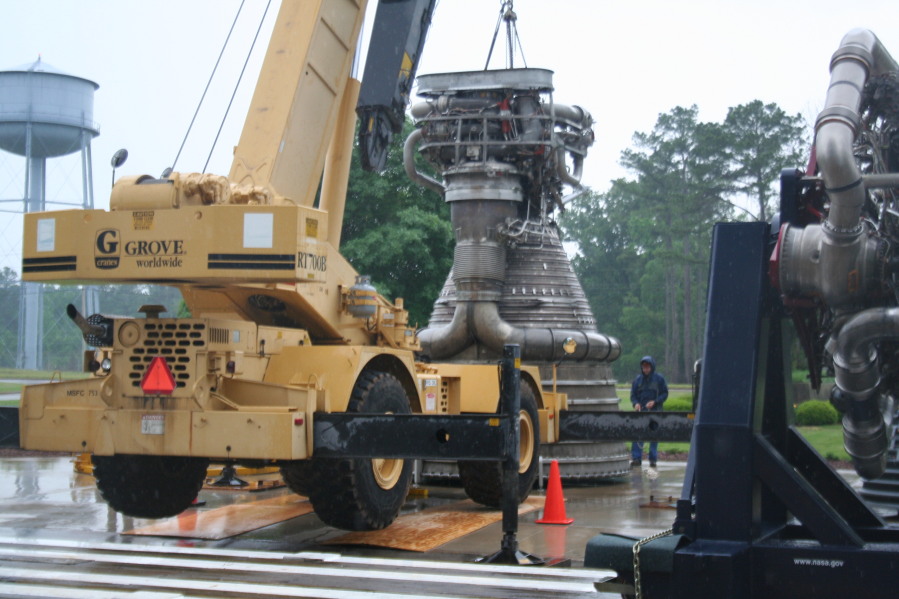 Placing F-1 rocket engine on throat support during Installation of Building 4200 Engines (May 13, 2008) at Marshall Space Flight Center Engine Displays