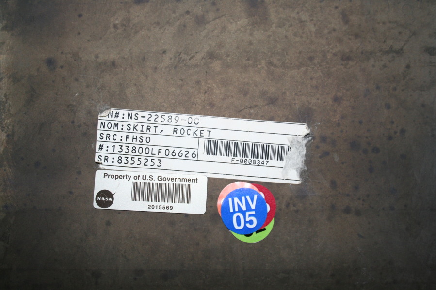 U.S. government property tag on F-1 rocket engine nozzle extension in storage at Marshall Space Flight Center