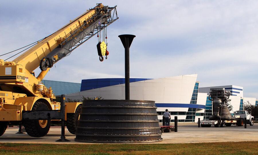 Positioning the F-1 rocket engine thrust chamber by the crane during F-4023 Installation at Building 4205 (October 21, 2009) at Marshall Space Flight Center Engine Displays