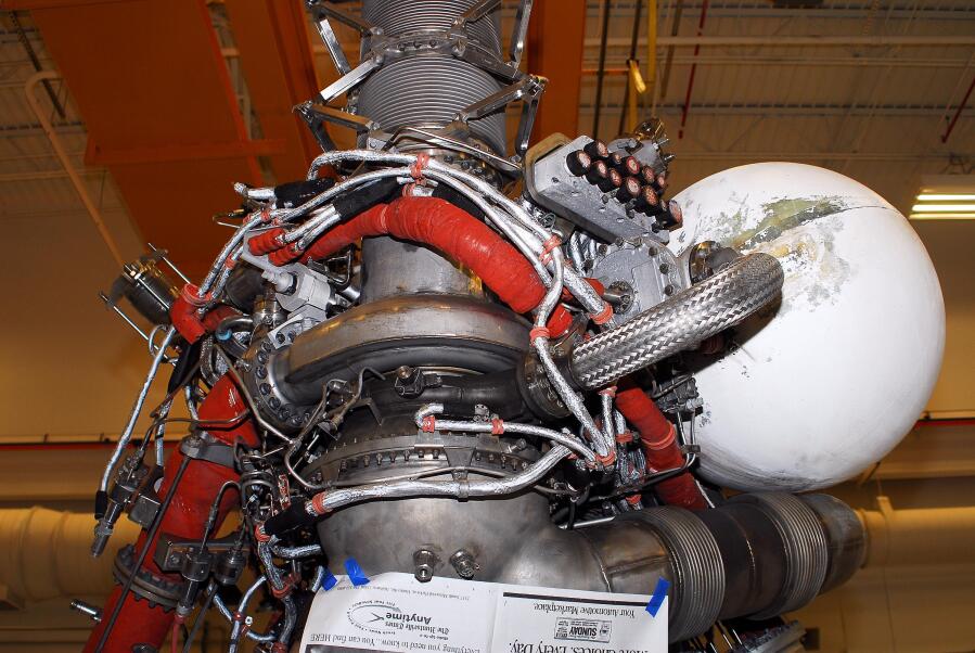 J-2 rocket LOX liquid oxygen inlet and turbopump engine prior to painting during Building 4200 J-2 Engine Prep (Nov 2007-Jan 2008) at Marshall Space Flight Center Engine Displays