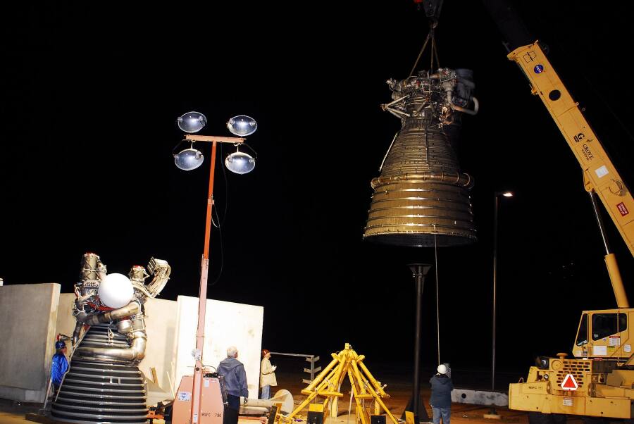 Lowering the F-1 rocket engine onto its throat support during F-5036 Fit Test (March 6, 2008) at Marshall Space Flight Center Engine Displays