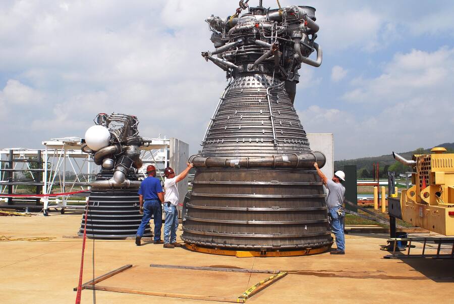 F-1 rocket engine lowered onto its nozzle extension during F-5036 Fit Test (April 7, 2008) at Marshall Space Flight Center Engine Displays