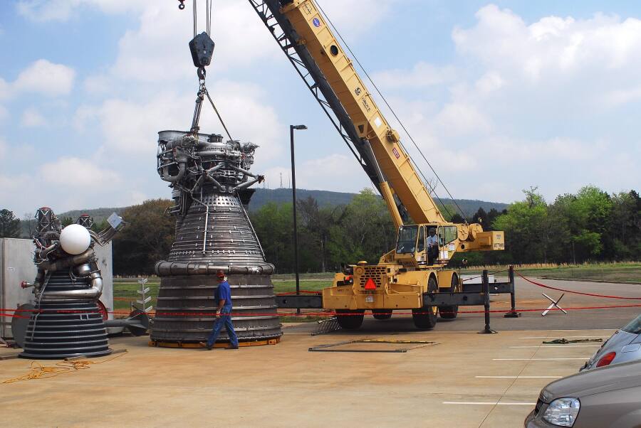 F-1 rocket engine lowered onto its nozzle extension during F-5036 Fit Test (April 7, 2008) at Marshall Space Flight Center Engine Displays