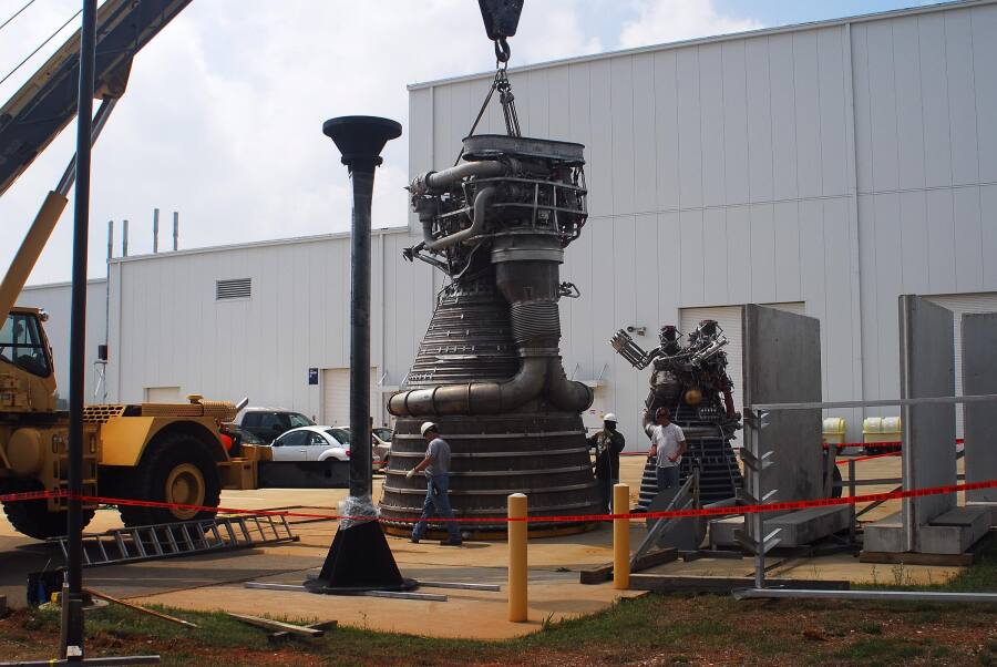 F-1 rocket engine lowered onto its nozzle extension during F-5036 Fit Test (April 7, 2008) at Marshall Space Flight Center Engine Displays