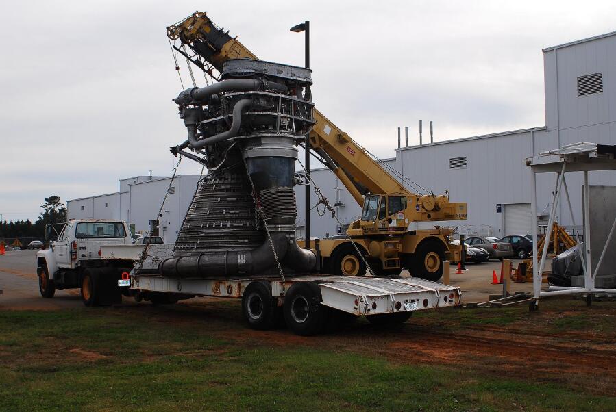 F-1 rocket engine on flatbed truck to be transported from behind Building 4205 to the front of the building during F-4023 Installation at Building 4205 (October 21, 2009) at Marshall Space Flight Center Engine Displays