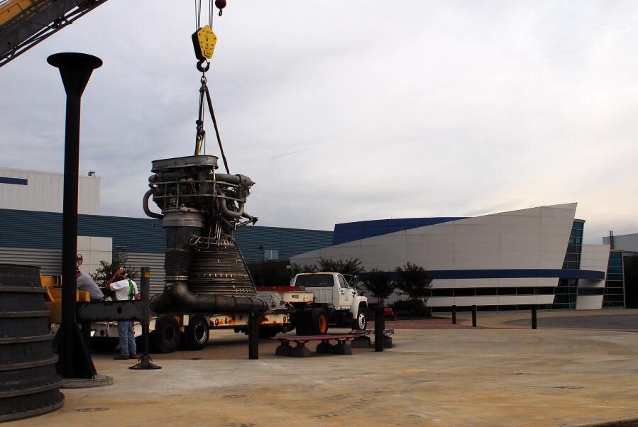 Placing the F-1 thrust chamber on the nozzle extension during F-4023 Installation at Building 4205 (October 21, 2009) at Marshall Space Flight Center Engine Displays
