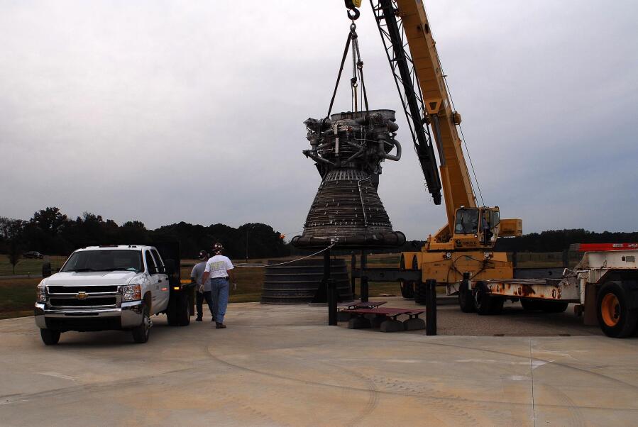 Placing the F-1 thrust chamber on the nozzle extension during F-4023 Installation at Building 4205 (October 21, 2009) at Marshall Space Flight Center Engine Displays