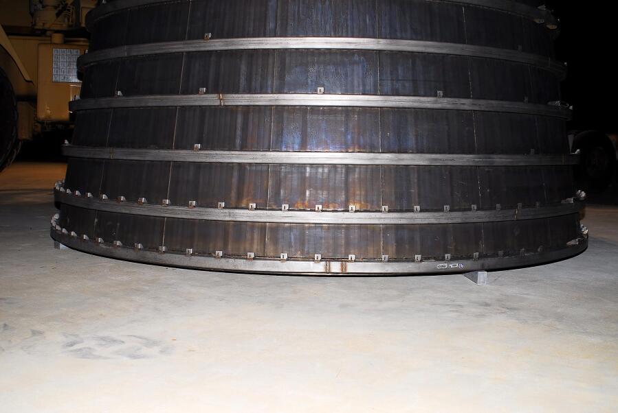 F-1 rocket engine's nozzle extension, suspending a few inches off the ground, during F-4023 Installation at Building 4205 (October 21, 2009) at Marshall Space Flight Center Engine Displays