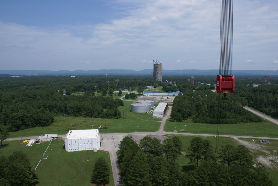 View of West Test Area Control Facility (Blockhouse), pumphouse, and Dynamic Test Stand from top of S-IC Test Stand at Marshall Space Flight Center