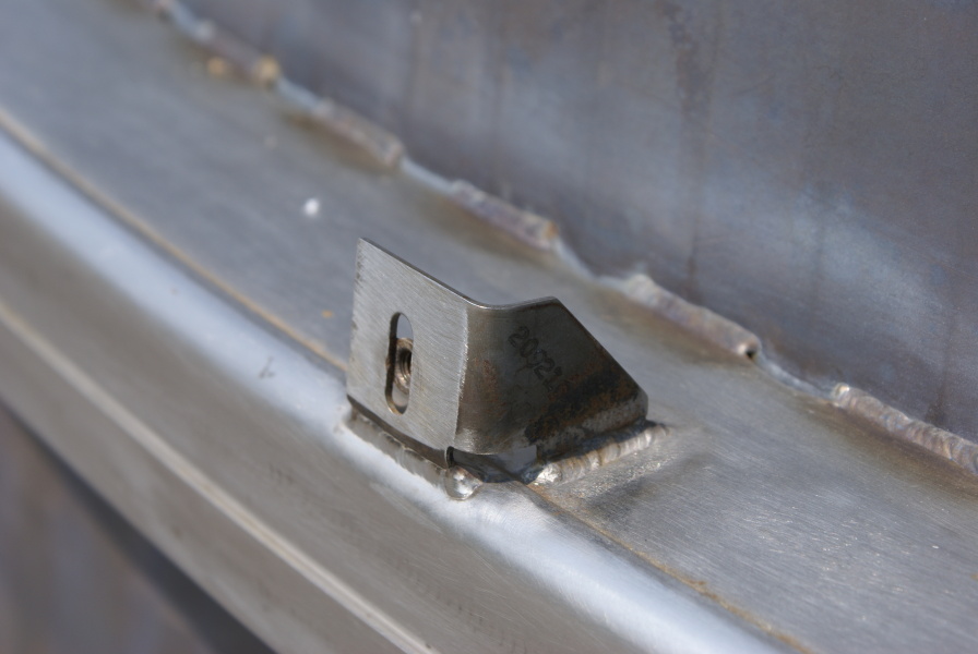 Thermal insulation tabs on the F-1 Nozzle Extension F-6045 hat bands at Marshall Space Flight Center