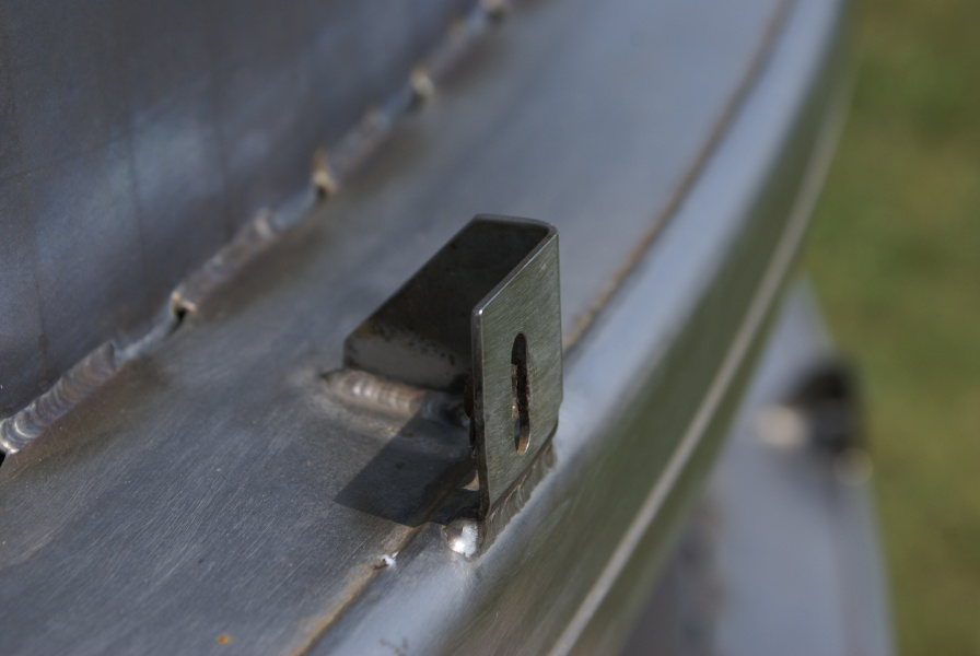 Thermal insulation tabs on the F-1 Nozzle Extension F-6045 hat bands at Marshall Space Flight Center