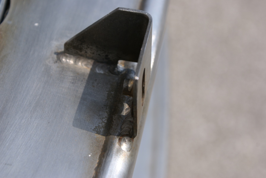 Thermal insulation tabs on the F-1 Nozzle Extension F-6045 hat bands at Marshall Space Flight Center