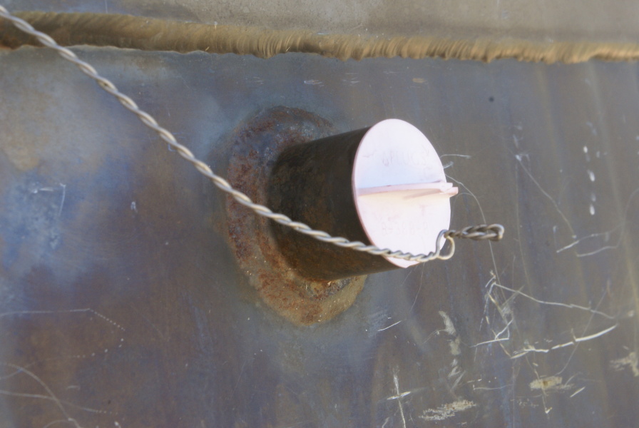 F-1 Engine F-4023 nozzle extension pyrotechnic igniter bosses and closures at Marshall Space Flight Center