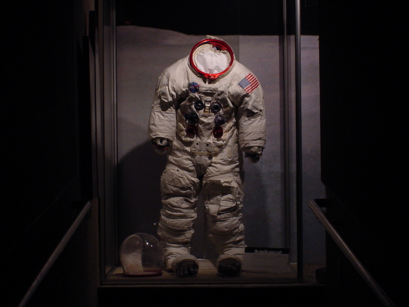 Armstrong's Apollo 11 Backup Suit at the end of a long, dark hallway at Neil Armstrong Air & Space