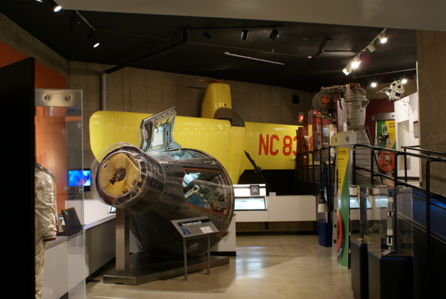 North gallery at Neil Armstrong Air & Space, including Armstrong's Gemini 8 suit, Gemini 8, Armstrong's first plane, and an H-1 engine