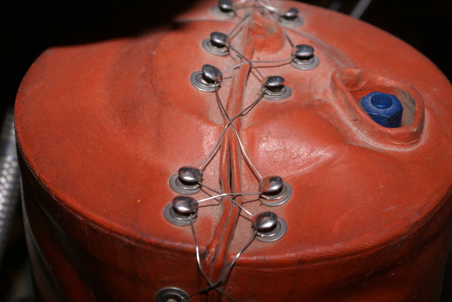 Wire closures (laces) on fuel additive blender unit's red heater assembly on H-1 Engine at Neil Armstrong Air & Space