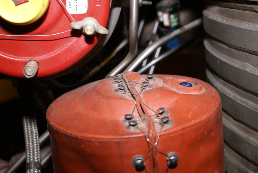 Wire closures (laces) on fuel additive blender unit's red heater assembly on H-1 Engine at Neil Armstrong Air & Space