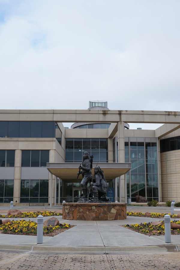 Entrance to Oklahoma History Center building, with Unconquered statue