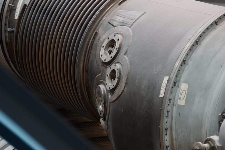 Heat exchanger helium and oxygen LOX supply and GOX return ports on F-1 Engine at Science Museum Oklahoma