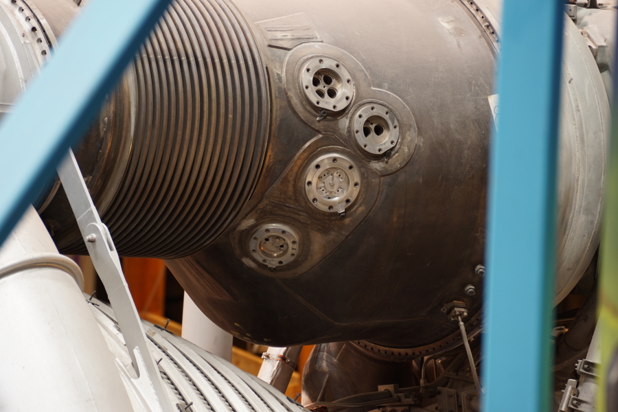 Heat exchanger helium and oxygen LOX supply and GOX return ports on F-1 Engine at Science Museum Oklahoma