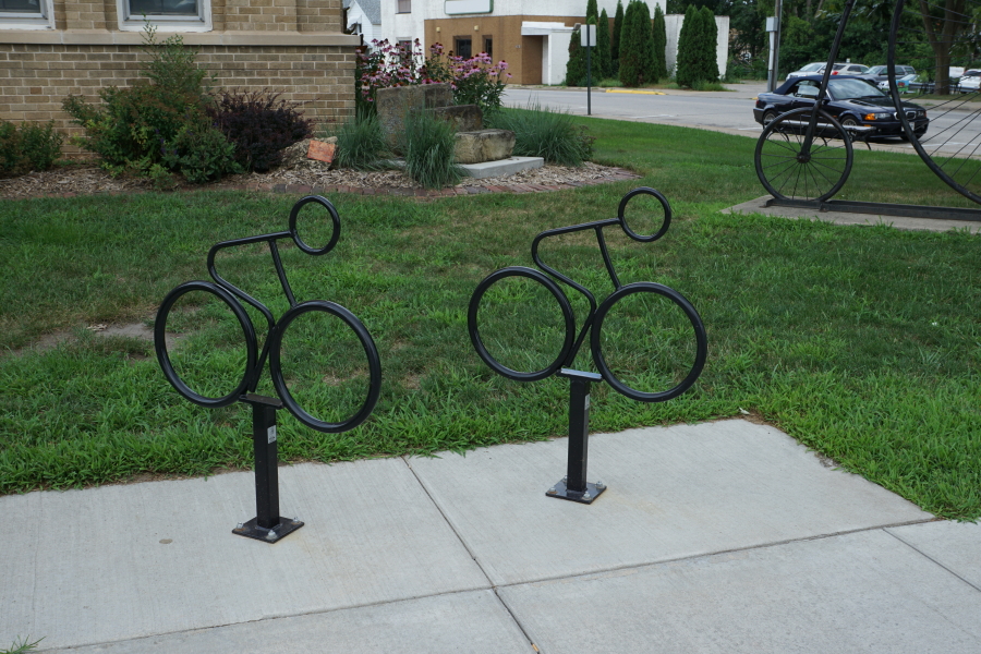 Bicycle-shaped bike racks in front of Deke Slayton Memorial Space and Bike Museum
