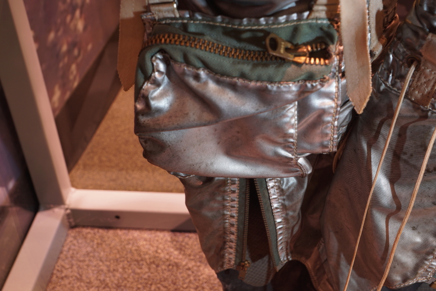 Leg zipper and leg pouch/accessory pocket on Cooper Mercury Suit right leg at St. Louis Science Center