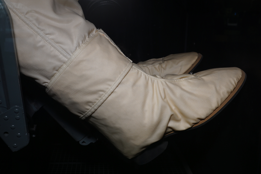 G4C suit boots on astronaut in Gemini Ejection Seat at Stafford Air & Space Museum
