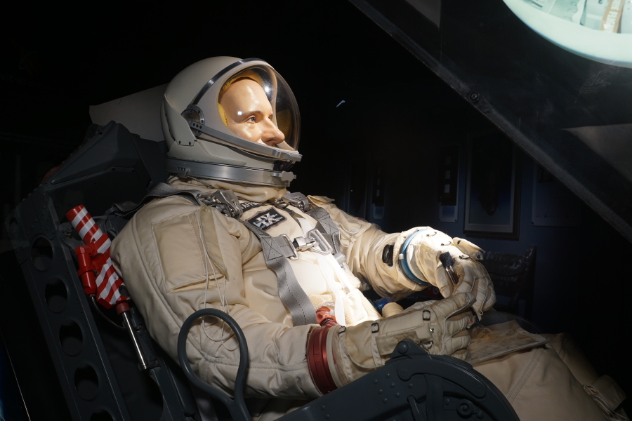 Astronaut in G4C suit sitting in Gemini Ejection Seat at Stafford Air & Space Museum